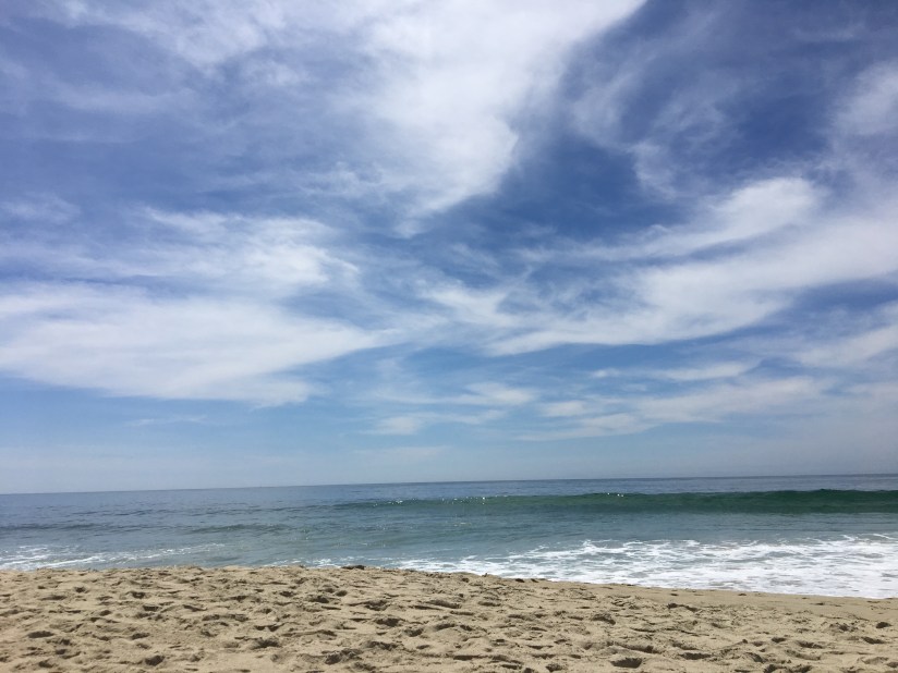 beach , ocean, blue sky with white clouds