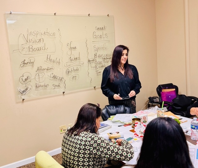 female teaching a small group of students